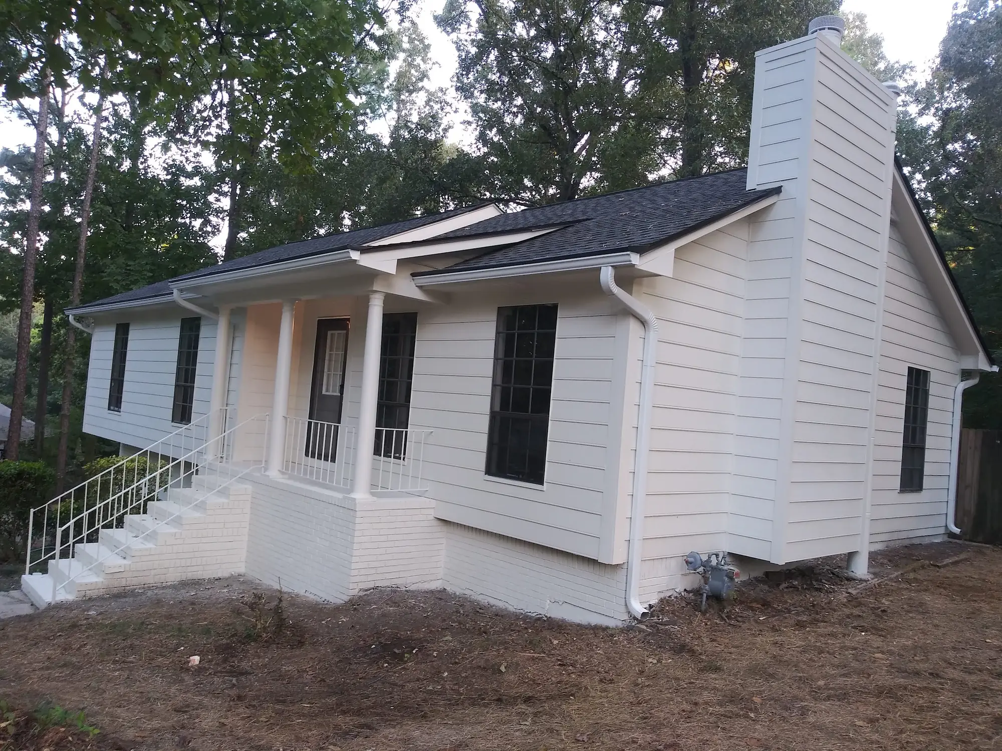 Finished white house after exterior painting by Painting in the South