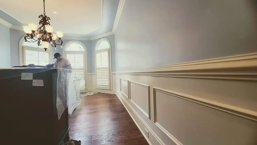 Blue dining room interior painting with white trim and molding