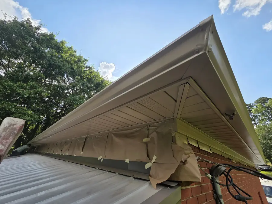 Exterior soffit and roof edge masked for painting