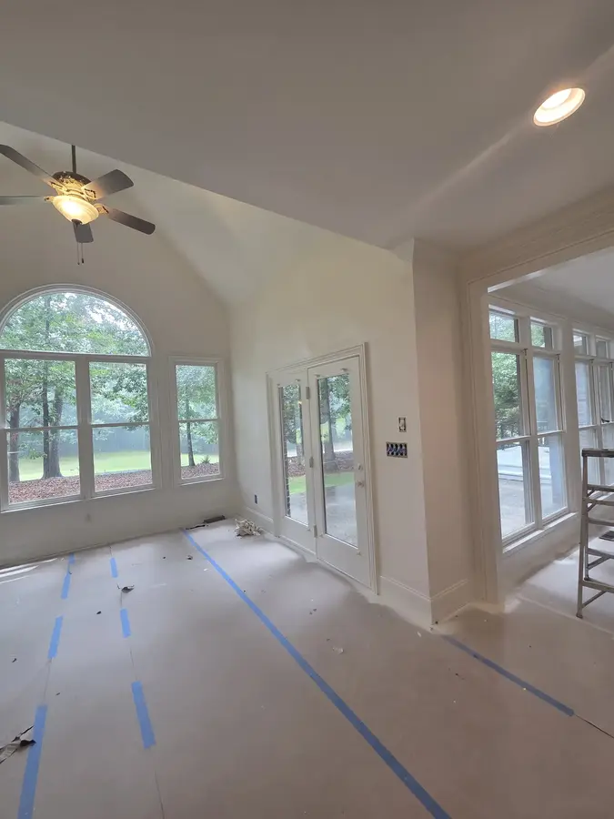 Finished interior walls and white trim after residential painting