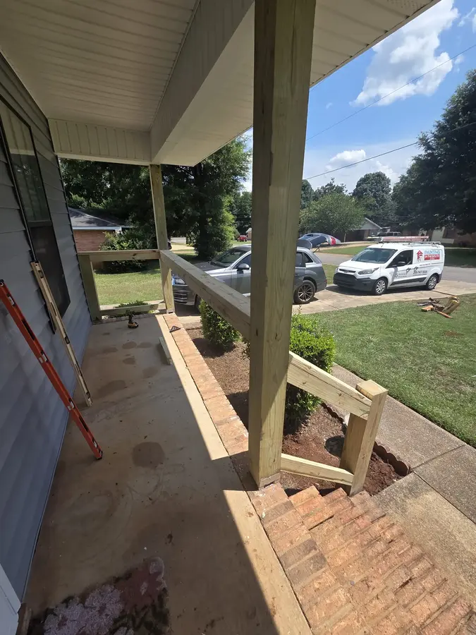 Front porch with old railing removed before exterior repair
